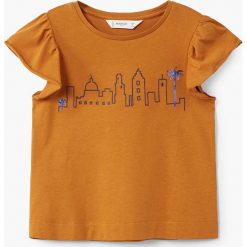 Mango Kids - Top dziecięcy Morocco 110-164 cm. Pomarańczowe bluzki dziewczęce marki Mango Kids, z nadrukiem, z bawełny, z okrągłym kołnierzem, z krótkim rękawem. W wyprzedaży za 29,90 zł.