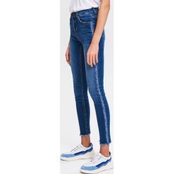 Spodnie slim z lampasami - Niebieski. Niebieskie spodnie damskie Reserved, z jeansu. Za 139,99 zł.
