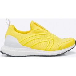 Adidas by Stella McCartney - Buty Ultra Boost Uncaged. Żółte buty damskie do fitnessu marki adidas by Stella McCartney, z gumy. W wyprzedaży za 699,90 zł.
