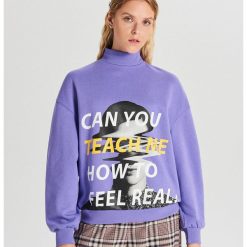 Bluza typu turtle neck z nadrukiem - Niebieski. Niebieskie bluzy damskie Cropp, s, z nadrukiem. W wyprzedaży za 29,99 zł.