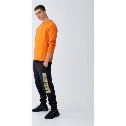 Spodnie joggersy 'Slow Down'. Czarne spodnie męskie marki Pull&Bear, m, bez wzorów, z dzianiny. Za 79,90 zł.