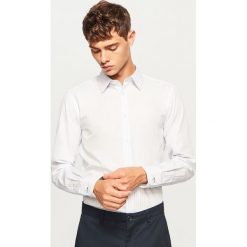 Prążkowana koszula regular fit - Niebieski. Niebieskie koszule męskie marki TRIBORD, m, z bawełny. W wyprzedaży za 49,99 zł.