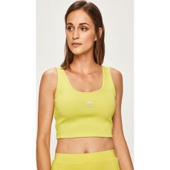 Adidas Originals - Top. Żółte topy damskie adidas Originals, bez wzorów, z elastanu, bez kołnierzyka. W wyprzedaży za 119,90 zł.