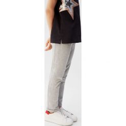 Mango Kids - Spodnie dziecięce Praga 110-164 cm. Szare spodnie dziewczęce Mango Kids, bez wzorów, z bawełny, casualowe. Za 45,90 zł.