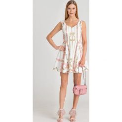 SUKIENKA GALINA GUESS. Różowe sukienki damskie Guess, na imprezę, s, z aplikacjami, bez kołnierzyka, z długim rękawem, długie, mini, rozkloszowane. Za 353,40 zł.