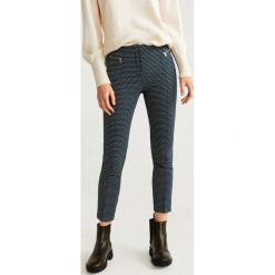 Mango - Spodnie Zippers. Niebieskie spodnie damskie Mango, bez wzorów, z elastanu, casualowe. Za 139,90 zł.