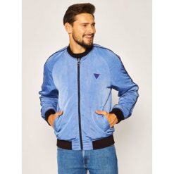 Kurtka bomber Guess Mineral Wash M0GL44 WCQE0. Niebieskie kurtki męskie Guess, xxl, z aplikacjami, z poliesteru, bez kaptura. W wyprzedaży za 589,00 zł.