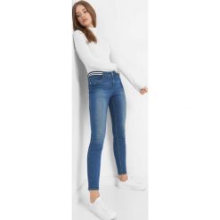 Jeansy skinny z paskiem. Niebieskie rurki damskie Orsay, w paski, z bawełny. Za 79,99 zł.