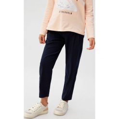 Mango Kids - Spodnie dziecięce Moon 110-164 cm. Niebieskie spodnie dziewczęce Mango Kids, bez wzorów, z elastanu, casualowe. W wyprzedaży za 59,90 zł.