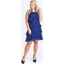Sukienka z falbankami granatowy. Niebieskie sukienki damskie N/A, plus size, bez wzorów, z elastanu, z falbankami, plus size, bez rękawów. Za 192,56 zł.