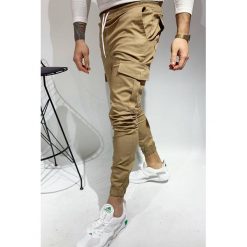 Męskie spodnie DANINO BEIGE. Brązowe jeansy męskie IVET, na co dzień, m, bez wzorów, z jeansu, sportowe. W wyprzedaży za 79,00 zł.