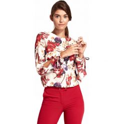 Bluzka z rozciętymi rękawami w kwiaty - XXL. Bluzki damskie e-margeritka.pl, s, w kwiaty, z poliesteru, eleganckie, z okrągłym kołnierzem, z krótkim rękawem. Za 118,99 zł.