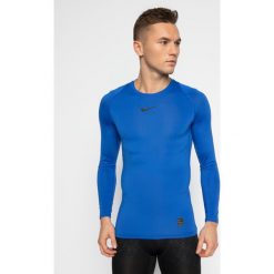 Koszulka techniczna NIKE Pro 838077. Czerwone koszulki męskie Nike, m, bez wzorów, z elastanu, sportowe, polo, bez rękawów. W wyprzedaży za 119,00 zł.