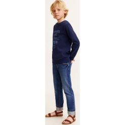 Mango Kids - Jeansy dziecięce Joe 104-164 cm. Zielone spodnie chłopięce marki Mango Kids, bez wzorów, z elastanu. Za 89,90 zł.
