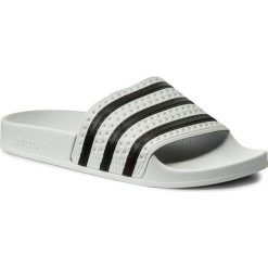 Klapki adidas - adilette 280648 White/None/White. Białe klapki damskie Adidas, bez wzorów, z tworzywa sztucznego, bez obcasa. W wyprzedaży za 119,00 zł.