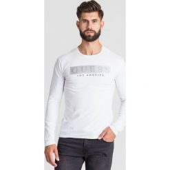LONGSLEEVE MISTERY TEE Guess. Białe bluzy męskie Guess, s, z nadrukiem, z elastanu, z okrągłym kołnierzem, bez rękawów, bez kaptura. Za 229,00 zł.