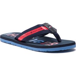 Japonki TOMMY HILFIGER - Bold Hilfiger Beach Sandal FM0FM01928 Midnight 403. Czerwone klapki męskie ze skóry. W wyprzedaży za 119,00 zł.
