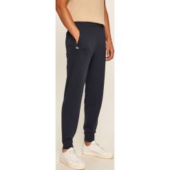 Lacoste - Spodnie. Niebieskie spodnie męskie Lacoste, na co dzień, s, bez wzorów, z elastanu. Za 479,90 zł.