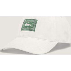 Lacoste - Czapka. Białe czapki męskie Lacoste, z aplikacjami, z bawełny. Za 239,90 zł.