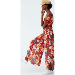 Spodnie palazzo w kwiaty. Czarne spodnie damskie Pull&Bear. Za 99,90 zł.
