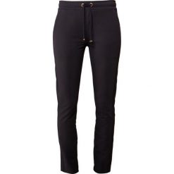 Bogner KYLIE Spodnie treningowe navy. Szare spodnie dresowe damskie marki Bogner, m, z nadrukiem, z bawełny. Za 749,00 zł.
