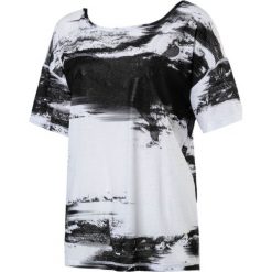 Topy sportowe damskie: Puma Koszulka damska Dancer Drapey Tee czarno biała r. S (515721 07)