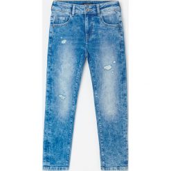 Marmurkowe jeansy slim fit - Niebieski. Niebieskie jeansy męskie Reserved, bez wzorów. W wyprzedaży za 69,99 zł.