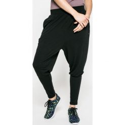 Puma - Spodnie Dancer Drapey. Czarne spodnie sportowe damskie marki Puma, s, z elastanu. W wyprzedaży za 119,90 zł.