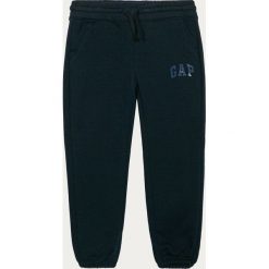 GAP - Spodnie dziecięce 104-176 cm. Różowe spodnie dziewczęce GAP, bez wzorów, z bawełny. Za 119,90 zł.