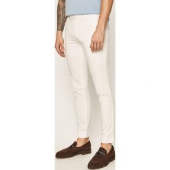 Polo Ralph Lauren - Spodnie. Białe spodnie męskie Polo Ralph Lauren, bez wzorów, z elastanu. W wyprzedaży za 499,90 zł.