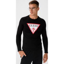 Guess Original Logo Koszulka Czarny. Czarne podkoszulki męskie Guess, l, z nadrukiem, z bawełny, z krótkim rękawem. Za 161,95 zł.