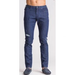 Granatowe jeansy męskie Slim Fit z przetarciami. Jeansy męskie Armani Jeans. Za 299,60 zł.