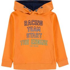Bluza w kolorze pomarańczowym. Pomarańczowe bluzy niemowlęce Tom Tailor Kids, z napisami, z bawełny, bez rękawów, bez kaptura. W wyprzedaży za 75,95 zł.
