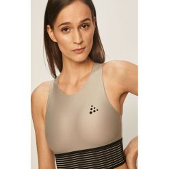 Craft - Biustonosz sportowy. Szare biustonosze sportowe damskie Craft, m, z aplikacjami, z elastanu. Za 179,90 zł.