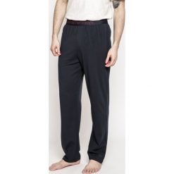 Emporio Armani - Spodnie. Brązowe spodnie męskie marki Emporio Armani, na co dzień, xl, bez wzorów, z elastanu, sportowe. W wyprzedaży za 119,90 zł.