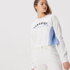 Krótka bluza w bloki kolorów - Kremowy. Białe bluzy damskie Sinsay, s, bez wzorów, z krótkim rękawem, krótkie, bez kaptura. Za 49,99 zł.