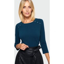 Bluzka dzianinowa. Bluzki damskie Greenpoint, bez wzorów, z elastanu, bez kołnierzyka, bez rękawów. Za 89,99 zł.