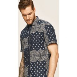 Tommy Jeans - Koszula. Niebieskie koszule męskie Tommy Jeans, s, bez wzorów, z bawełny, klasyczne, z klasycznym kołnierzykiem, z krótkim rękawem. W wyprzedaży za 319,90 zł.