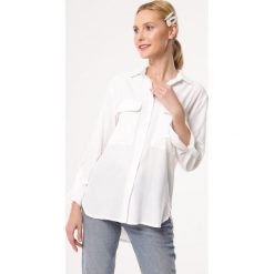 Biała Koszula Realist. Białe bluzki damskie Born2be, s, bez wzorów, z jeansu, klasyczne, z klasycznym kołnierzykiem, z długim rękawem. Za 89,99 zł.