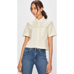 Calvin Klein Jeans - Bluzka. Żółte bluzki damskie Calvin Klein Jeans, s, bez wzorów, z bawełny, bez kołnierzyka, z krótkim rękawem. W wyprzedaży za 159,90 zł.
