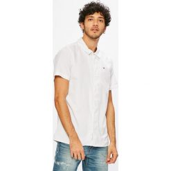 Tommy Jeans - Koszula DM0DM04496. Niebieskie koszule męskie Tommy Jeans, s, bez wzorów, z jeansu, klasyczne, z klasycznym kołnierzykiem, z krótkim rękawem. W wyprzedaży za 179,90 zł.