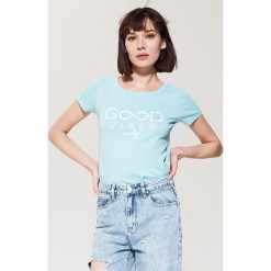 T-shirt z nadrukiem - Turkusowy. Niebieskie t-shirty damskie House, s, z nadrukiem, bez kołnierzyka. Za 35,99 zł.