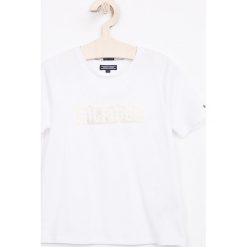 Tommy Hilfiger - Top dziecięcy 110-176 cm. Białe bluzki dziewczęce TOMMY HILFIGER, z nadrukiem, z bawełny, z okrągłym kołnierzem, z krótkim rękawem. Za 99,90 zł.