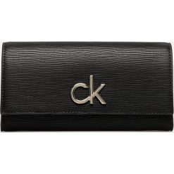 Calvin Klein - Portfel. Czarne portfele damskie Calvin Klein, bez wzorów, ze skóry ekologicznej. Za 299,90 zł.