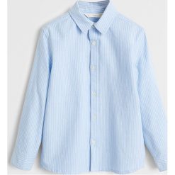 Mango Kids - Koszula dziecięca (110 - 164) Oxfordp. Niebieskie koszule chłopięce z bawełny, eleganckie, długie. Za 59,90 zł.
