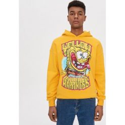 Bluza z nadrukiem SpongeBob - Żółty. Żółte bluzy męskie House, s, z nadrukiem, bez kołnierzyka, bez rękawów, bez kaptura. Za 119,99 zł.