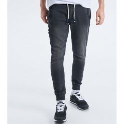 Jeansy Slim Jogger - Szary. Szare jeansy męskie Cropp, m, bez wzorów. Za 119,99 zł.