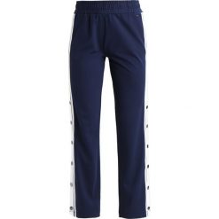Jeansy damskie: Tommy Jeans SNAP PANT Spodnie treningowe black iris