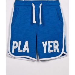 Blukids - Szorty dziecięce 98-128 cm. Niebieskie spodenki chłopięce Blukids, z nadrukiem, z bawełny, sportowe. W wyprzedaży za 19,90 zł.