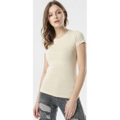 Jasnobeżowy T-shirt Echolaira. Brązowe t-shirty damskie Born2be, s, bez wzorów, sportowe, z okrągłym kołnierzem. Za 34,99 zł.